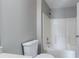 Bathroom with a white toilet and a shower-tub combo at 3673 Jervis Ct, Rex, GA 30273