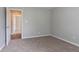 Bedroom with carpet, light grey walls, and an open door at 3673 Jervis Ct, Rex, GA 30273