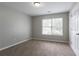 Bedroom with carpet flooring and a bright window at 3673 Jervis Ct, Rex, GA 30273