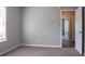 Bedroom with open door, window, and carpet at 3673 Jervis Ct, Rex, GA 30273