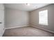 Bedroom with carpet and a bright window at 3673 Jervis Ct, Rex, GA 30273