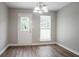 Bright dining room with modern light fixture and direct access to backyard at 3673 Jervis Ct, Rex, GA 30273