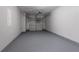 Attached single-car garage with grey floor paint at 3673 Jervis Ct, Rex, GA 30273