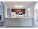 The kitchen features an open layout with white appliances and dark cabinetry at 3673 Jervis Ct, Rex, GA 30273