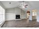 A bright, open-concept room has an arched entry, vaulted ceilings and ample natural light at 3673 Jervis Ct, Rex, GA 30273