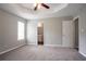 Open main bedroom with carpet, window and ensuite bathroom at 3673 Jervis Ct, Rex, GA 30273