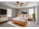 Tranquil main bedroom with a tray ceiling and ample natural light at 3673 Jervis Ct, Rex, GA 30273