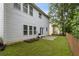 A lush backyard featuring a neatly fenced lawn and a patio, perfect for outdoor gatherings and relaxation at 4266 Suwanee Brook Ct, Buford, GA 30518