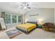 Bright bedroom with large windows, vaulted ceiling, and modern furnishings at 4266 Suwanee Brook Ct, Buford, GA 30518