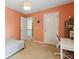 A brightly painted bedroom features an open doorway, inviting a sense of flow and connectivity within the home at 4266 Suwanee Brook Ct, Buford, GA 30518