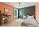 Charming bedroom with a cozy bed, desk, and playful decor for a delightful and imaginative space at 4266 Suwanee Brook Ct, Buford, GA 30518