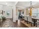 Open-concept dining room adjacent to entry and living room, featuring hardwood floors and natural light at 4266 Suwanee Brook Ct, Buford, GA 30518