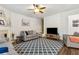 Inviting living room with hardwood floors and stylish area rug at 4266 Suwanee Brook Ct, Buford, GA 30518