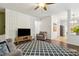 Comfortable living area with a decorative accent wall and neutral tones at 4266 Suwanee Brook Ct, Buford, GA 30518