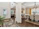 Open-concept living space with hardwood floors, seamlessly connecting the living room, dining area, and foyer at 4266 Suwanee Brook Ct, Buford, GA 30518
