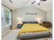 Bright main bedroom with a high ceiling, a ceiling fan, and ample natural light from a large window at 4266 Suwanee Brook Ct, Buford, GA 30518