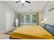 Bright main bedroom with natural light from large windows, vaulted ceiling, and ceiling fan at 4266 Suwanee Brook Ct, Buford, GA 30518