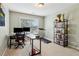 This bright home office features a treadmill, providing a dedicated space for work and exercise at 4266 Suwanee Brook Ct, Buford, GA 30518
