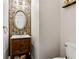 Charming powder room with decorative mirror and vanity at 4266 Suwanee Brook Ct, Buford, GA 30518