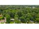 Establishing shot of neighborhood amongst mature trees; houses are set back from the street at 2045 Sherwood Se Dr, Marietta, GA 30067