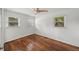 Cozy bedroom with hardwood floors, white walls and trim, and natural light from two windows at 2045 Sherwood Se Dr, Marietta, GA 30067