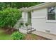 Inviting entrance with steps, iron railing and a green front door at 2045 Sherwood Se Dr, Marietta, GA 30067