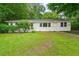 Charming single-story home with a well-maintained lawn and mature trees at 2045 Sherwood Se Dr, Marietta, GA 30067