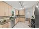 Modern kitchen with granite counters and stainless steel appliances at 2045 Sherwood Se Dr, Marietta, GA 30067