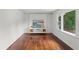 Bright living room with hardwood floors and a decorative fireplace with floating shelves at 2045 Sherwood Se Dr, Marietta, GA 30067