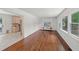 Open-concept living area with hardwood floors and connection to the kitchen at 2045 Sherwood Se Dr, Marietta, GA 30067