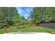 The backyard has trimmed bushes lining the fence creating a serene and green landscape at 3642 Lake Estates Way Way, Atlanta, GA 30349