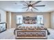 Comfortable bedroom featuring a mirrored dresser and a large ceiling fan at 3642 Lake Estates Way Way, Atlanta, GA 30349