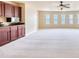 Open bonus room featuring a wet bar area and natural light at 3642 Lake Estates Way Way, Atlanta, GA 30349