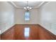 Dining room with hardwood floors, wainscoting, and a chandelier at 3642 Lake Estates Way Way, Atlanta, GA 30349