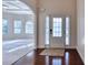 Spacious foyer with hardwood floors and views into a living space with coffered ceilings at 3642 Lake Estates Way Way, Atlanta, GA 30349
