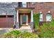 Inviting front porch with stone pillars and manicured landscaping, offering a warm welcome at 3642 Lake Estates Way Way, Atlanta, GA 30349