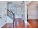 Hallway with hardwood floors, staircase, and views into other rooms at 3642 Lake Estates Way Way, Atlanta, GA 30349