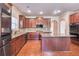 Open concept kitchen includes stainless appliances, granite countertops, hardwood floors, island and lots of cabinet space at 3642 Lake Estates Way Way, Atlanta, GA 30349