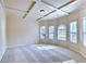Bright living room featuring coffered ceilings, neutral carpet, and lots of natural light at 3642 Lake Estates Way Way, Atlanta, GA 30349