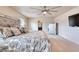 Elegant main bedroom with ceiling fan, dresser and ensuite bathroom at 3642 Lake Estates Way Way, Atlanta, GA 30349