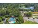 Aerial view of a neighborhood with community pool, tennis courts, and a beautiful lake at 3897 Tanbark Ct, Marietta, GA 30066