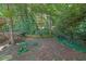 A densely wooded area with a sloped landscape and a small creek providing privacy at 3897 Tanbark Ct, Marietta, GA 30066