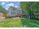 This backyard features a deck, a well-manicured lawn, and privacy fencing all around at 3897 Tanbark Ct, Marietta, GA 30066