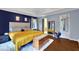 Spacious primary bedroom with wood floors, large windows, and a walk-in closet at 3897 Tanbark Ct, Marietta, GA 30066