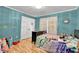 Colorful bedroom with blue walls and playful decor at 3897 Tanbark Ct, Marietta, GA 30066