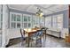 Dining area featuring a wood table, chair set and large windows with bright natural light at 3897 Tanbark Ct, Marietta, GA 30066