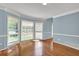 Bright living area with hardwood floors, neutral wall paint, and an exterior view from large windows at 3897 Tanbark Ct, Marietta, GA 30066