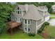 Exterior view of a house with a raised deck overlooking a large grassy backyard at 414 Wallis Farm Way, Marietta, GA 30064