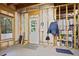 Unfinished basement with concrete floor, window, and exterior access door at 414 Wallis Farm Way, Marietta, GA 30064