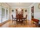 Elegant dining room featuring hardwood floors, a chandelier, and a decorative china cabinet at 414 Wallis Farm Way, Marietta, GA 30064